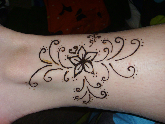 Flower and vines on ankle - flower tattoo