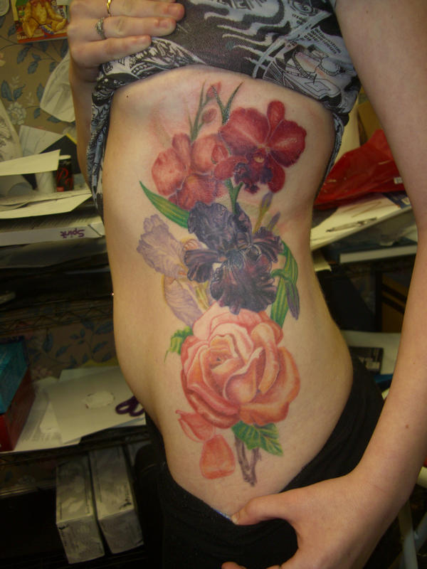 kim's side piece finally done - flower tattoo