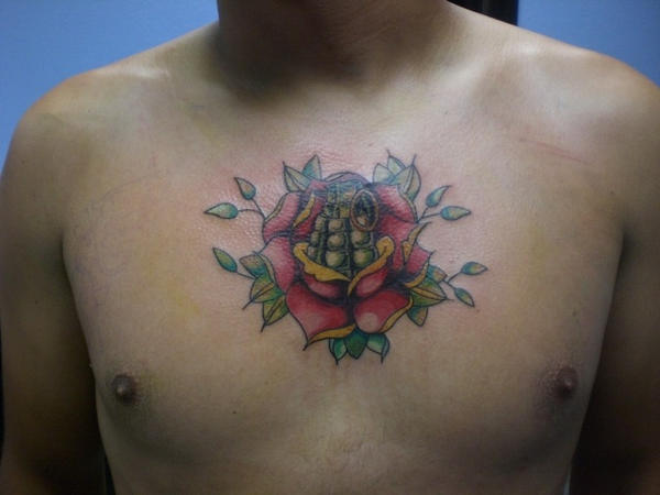 Grenade Flowers - chest tattoo