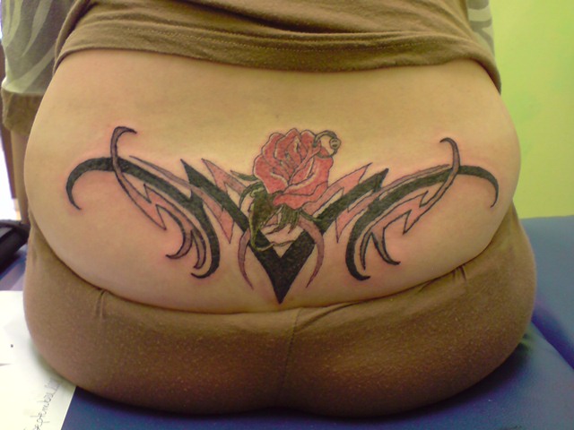 Flower tribal back tattoo by