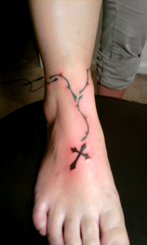 vine tattoo designs on foot. foot tattoos. Vine and Cross