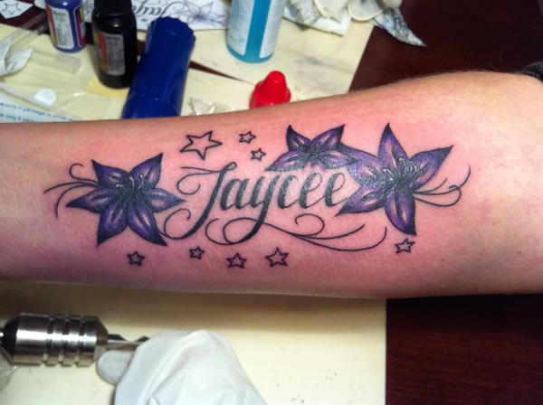 flowers with script tattoo by